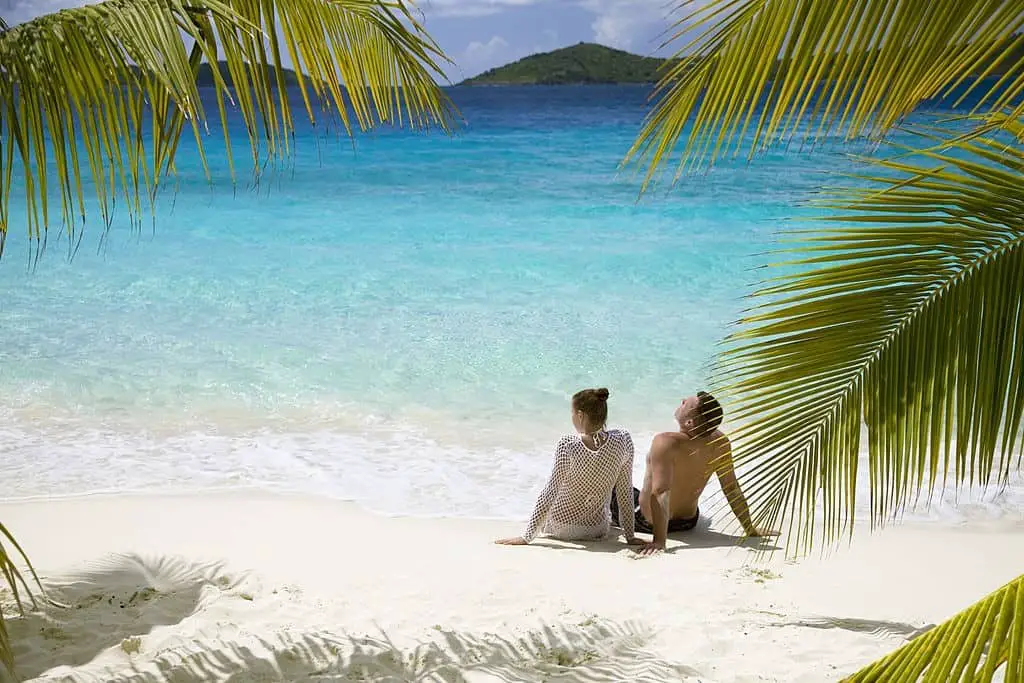 couple relaxing on the caribbean beach