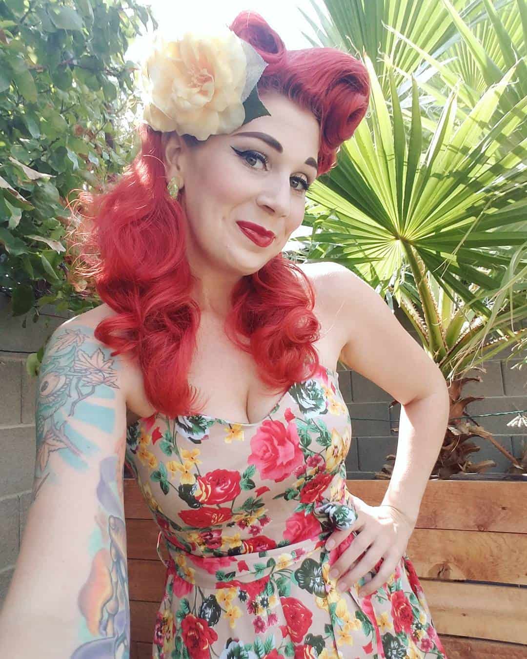 bright red curls and floral clip