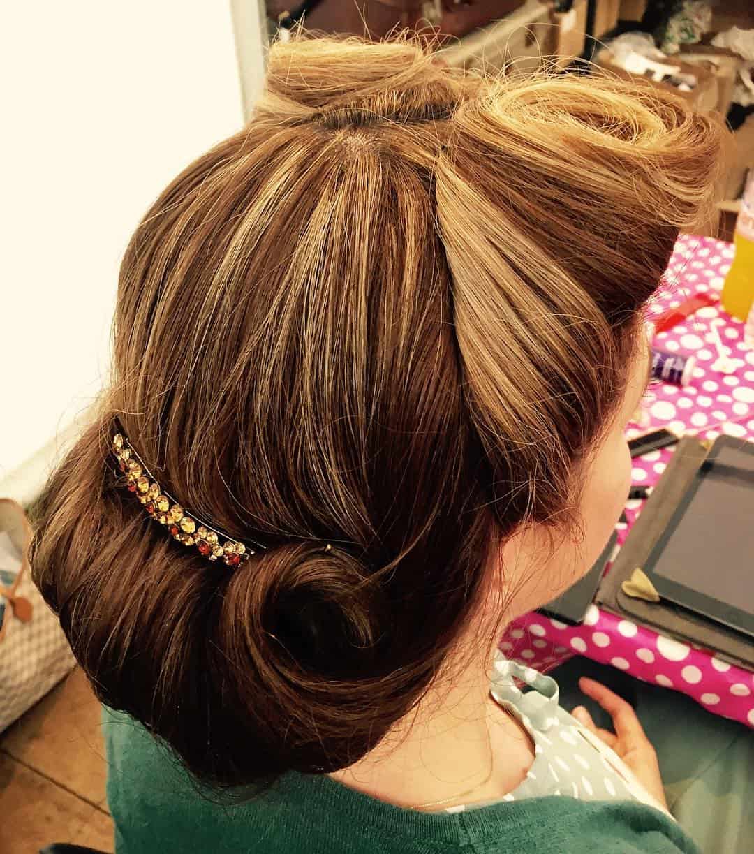 victory roll updo with jeweled clip