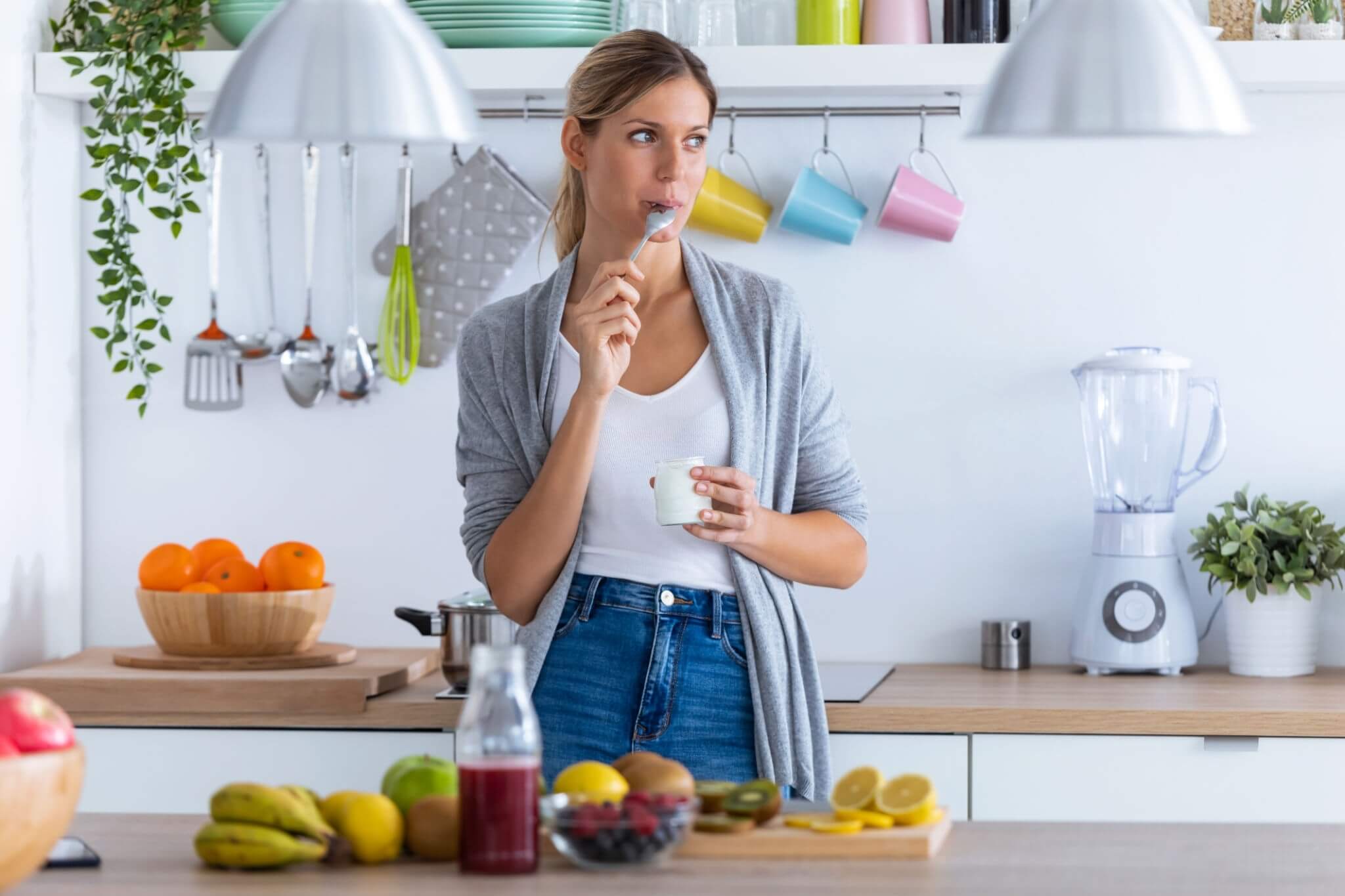 young woman eating yogurt